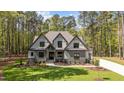 Two story home with manicured lawn and neutral color scheme offers curb appeal at 330 Hidden Lake Dr, Youngsville, NC 27596