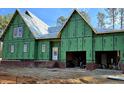 New home under construction showing Zip System sheathing, brick base and a two car garage at 3331 Colby Chase Dr # 8, Apex, NC 27539