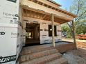 View of the brick stairs leading to the covered front porch of this new construction home at 208 E Whitaker Mill Rd, Raleigh, NC 27608