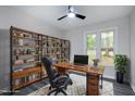 Home office with built-in shelving and hardwood floors at 116 Oak Ridge Dr, Willow Springs, NC 27592