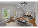 Open concept living area with dining space, hardwood floors, and neutral paint at 605 Quarry St, Raleigh, NC 27601