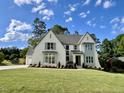 Elegant two-story home with lush lawn, manicured landscaping, and a welcoming facade at 217 Dublin Rd, Raleigh, NC 27609