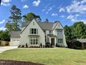 Stylish two-story home featuring manicured lawn, attached garage, and classic architectural accents at 217 Dublin Rd, Raleigh, NC 27609