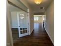 Inviting foyer with hardwood floors and a view of the open living space at 120 Wild Turkey Way, Lillington, NC 27546