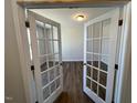 Bright office space with elegant glass French doors and hardwood flooring at 120 Wild Turkey Way, Lillington, NC 27546