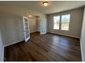 Spacious home office with natural light, hardwood floors, and double glass doors at 120 Wild Turkey Way, Lillington, NC 27546
