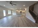 Open concept kitchen and living area with island at 40 Capeside Ct, Lillington, NC 27546