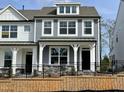 Charming new two-story home features a fenced yard and a welcoming front porch at 490 Traditions Grande Blvd # 27, Wake Forest, NC 27587