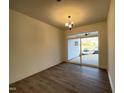 Spacious living room featuring wood flooring and sliding glass doors leading to outdoor space at 490 Traditions Grande Blvd # 27, Wake Forest, NC 27587