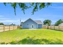 Spacious backyard featuring a brand new wooden fence and a well-maintained lawn at 306 E Godwin St, Dunn, NC 28334