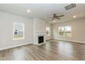 Bright living room featuring a fireplace, recessed lighting, and large windows at 225 Hopewell Branch Ct, Smithfield, NC 27577