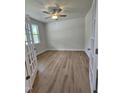 Spacious bedroom with carpet flooring, a ceiling fan, and natural light from a window at 104 Gin Branch Rd, Wendell, NC 27591