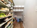Walk-in storage area featuring built-in shelving units with plenty of shoe storage at 137 Shadowdale Ln, Rolesville, NC 27571