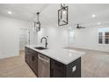 Eat-in kitchen island with sink, dishwasher, and pendant lighting at 1429 Patchings Ln, Knightdale, NC 27545