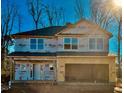 Two-story home with gray vinyl siding and a two-car garage at 339 Bishop Ln, Sanford, NC 27330