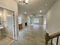 Spacious living room with LVP flooring and a fireplace at 339 Bishop Ln, Sanford, NC 27330