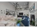Spacious living room with vaulted ceiling, fireplace, and comfortable seating at 4600 Scottland Dr, Mebane, NC 27302