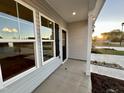 Covered front porch with a view of the sunset at 215 Britt St, Smithfield, NC 27577