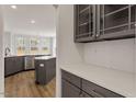 Modern kitchen with gray cabinets, quartz countertops, and stainless steel appliances at 80 Bold Dr, Youngsville, NC 27596