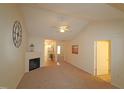 Spacious living room with vaulted ceiling, fireplace and neutral decor at 11370 Clubhaven Pl # 103, Raleigh, NC 27617