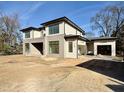 Stylish two-story home with modern architecture, featuring an attached garage and sleek design elements at 712 Daniels St, Raleigh, NC 27605