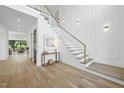Elegant foyer features hardwood floors, staircase, and decorative lighting for a grand entrance at 712 Daniels St, Raleigh, NC 27605