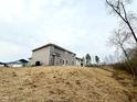 View of the back of the home and the surrounding lot at 31 Capeside Ct, Lillington, NC 27546