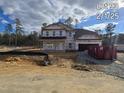 Two-story home with a gray exterior and a large front yard at 19 Streamline Ct, Lillington, NC 27546