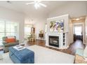 Spacious living room with fireplace, hardwood floors, and access to dining area at 2227 Delaney Dr # 313, Burlington, NC 27215