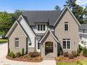 Beautiful two-story home with brick and siding exterior, featuring a well-manicured lawn and a welcoming entryway at 701 Dartmouth Rd, Raleigh, NC 27609