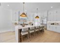 Bright and spacious kitchen boasts a large island with seating and modern stainless-steel appliances at 701 Dartmouth Rd, Raleigh, NC 27609