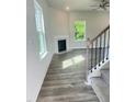 Inviting living room with modern fireplace and hardwood floors at 321 Hopewell Branch Ct, Smithfield, NC 27577