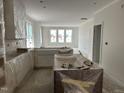 Spacious kitchen area awaiting countertops, paint, and appliances at 2408 Adrift Road, Fuquay Varina, NC 27526