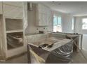Spacious kitchen area awaiting countertops, paint, and appliances at 2408 Adrift Road, Fuquay Varina, NC 27526