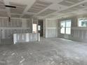 Spacious living room displaying drywall, recessed lighting, and large windows for natural light at 2404 Adrift Rd, Fuquay Varina, NC 27526