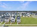 Aerial view of a new neighborhood with multiple houses and green space at 40 Pansy Park # 87, Clayton, NC 27520