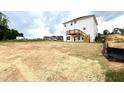 View of backyard and deck of newly constructed home in a residential neighborhood at 315 Bishop Ln, Sanford, NC 27330