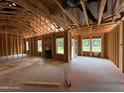 Spacious living room with framing nearly complete and lots of natural light at 375 Graham Rd, Cameron, NC 28326