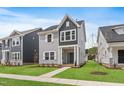 Charming two-story home with gray siding, white trim, and a well-manicured lawn at 757 Portland Rose Dr, Knightdale, NC 27545