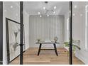 Stylish home office with glass doors, modern lighting, and neutral decor at 113 S Ennis St, Fuquay Varina, NC 27526