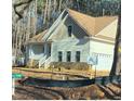 House exterior showcasing a large front porch and stone detailing at 6021 Inverness Cir, Sanford, NC 27332