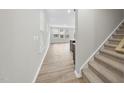 Inviting entryway showcasing hardwood floors, stairs, and abundant natural light at 28 Nettle Ln # 235, Clayton, NC 27520