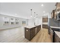 Spacious kitchen with an island, modern stainless steel appliances, and lots of natural light at 28 Nettle Ln # 235, Clayton, NC 27520