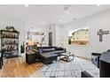 Bright living room featuring hardwood floors, modern furnishings, and abundant natural light at 1511 Malta Ave, Raleigh, NC 27610