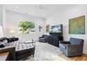 Well-lit living room with hardwood floors, comfortable seating, and contemporary decor at 1511 Malta Ave, Raleigh, NC 27610