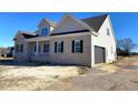 Two-story house with a side view showcasing a large garage at 1743 S Old Carriage Rd, Rocky Mount, NC 27804