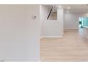 Bright entryway showcasing hardwood floors, staircase, and access to the open-concept living area at 3181 Mission Olive Pl # 346, New Hill, NC 27562