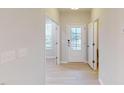 Bright foyer with hardwood floors, glass front door, and access to various rooms at 3181 Mission Olive Pl # 346, New Hill, NC 27562