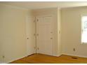 Bright bedroom with hardwood floors, two doors and window with natural light at 301 Briarcliff Dr, Dunn, NC 28334