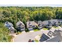 An aerial view of a neighborhood showcasing well-maintained homes and lush green trees at 8406 Wheatstone Ln, Raleigh, NC 27613